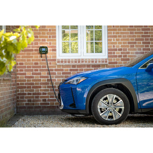 Ohme Home Pro 7.4kW EV Charger installed on brick wall next to window