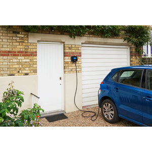 Ohme Home Pro 7.4kW EV Charger installed on brick next to door/garage