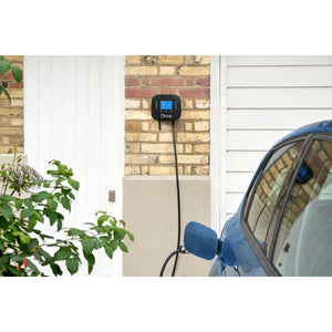 Ohme Home Pro 7.4kW EV Charger installed on brick next to door/garage 2