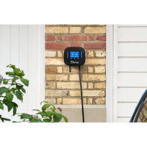 Ohme Home Pro 7.4kW EV Charger installed on brick next to door/garage 3