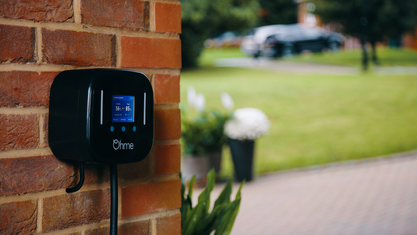 Ohme Home Pro 7.4kW EV Charger installed on brick close-up